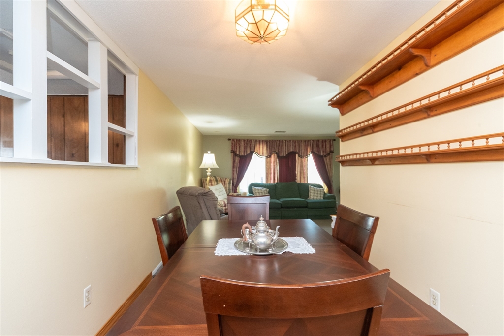221 Sinclair Road Brockton, MA 02302 - Photo 7 of 26 a view of a dining room with furniture and a window