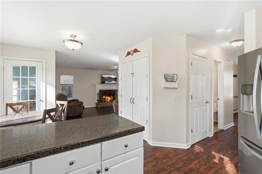 7140 Hunters Trace Drive Cumming, GA 30028 - Photo 16 of 35 a kitchen with a sink and refrigerator