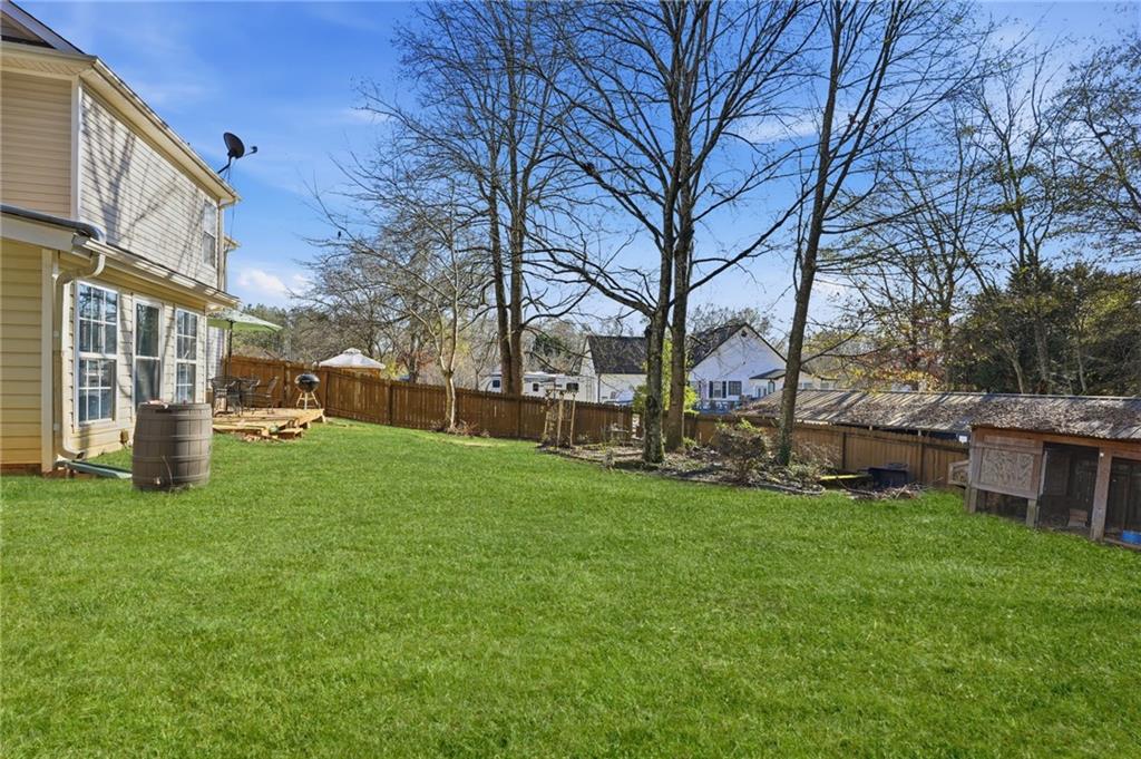 7140 Hunters Trace Drive Cumming, GA 30028 - Photo 32 of 35 a view of a yard with a house