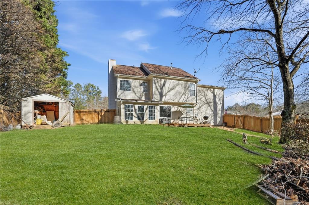 7140 Hunters Trace Drive Cumming, GA 30028 - Photo 33 of 35 a view of a house with a yard
