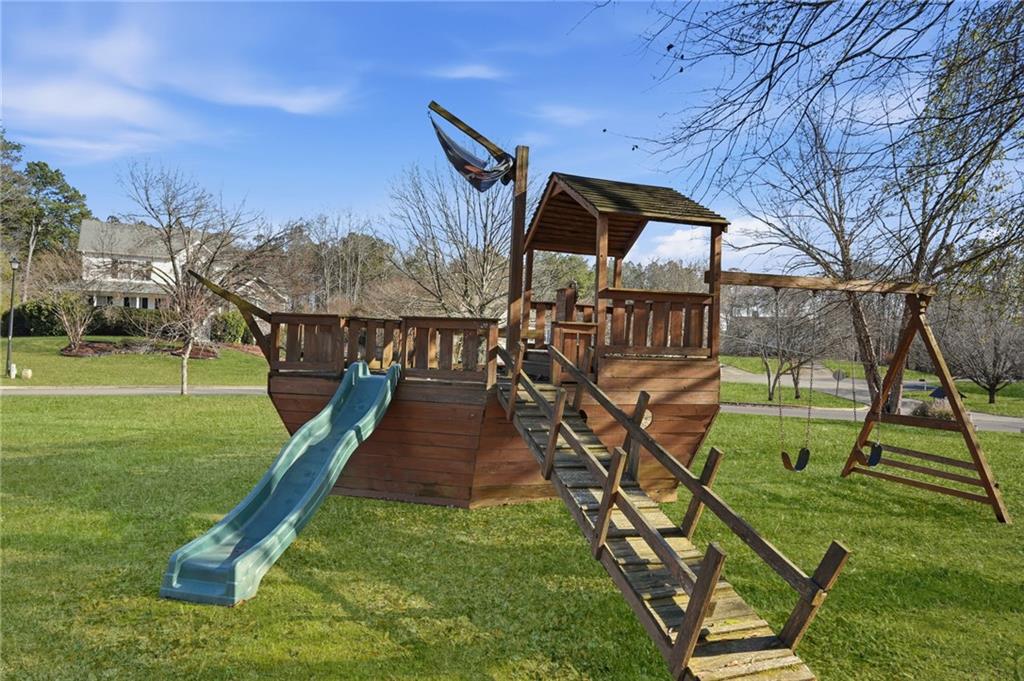 7140 Hunters Trace Drive Cumming, GA 30028 - Photo 35 of 35 a view of a swimming pool with a backyard