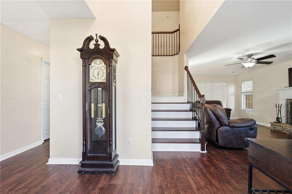 7140 Hunters Trace Drive Cumming, GA 30028 - Photo 7 of 35 a view of entryway and hall with wooden floor