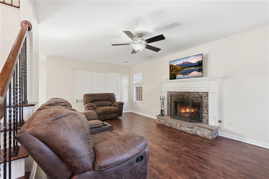 7140 Hunters Trace Drive Cumming, GA 30028 - Photo 9 of 35 a living room with furniture and a fireplace