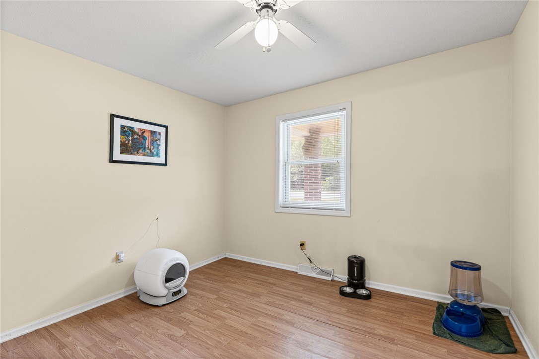 322 Tribble Street Honea Path, SC 29654 - Photo 19 of 35 Warm wood flooring and a single window define this versatile auxiliary bedroom space.
