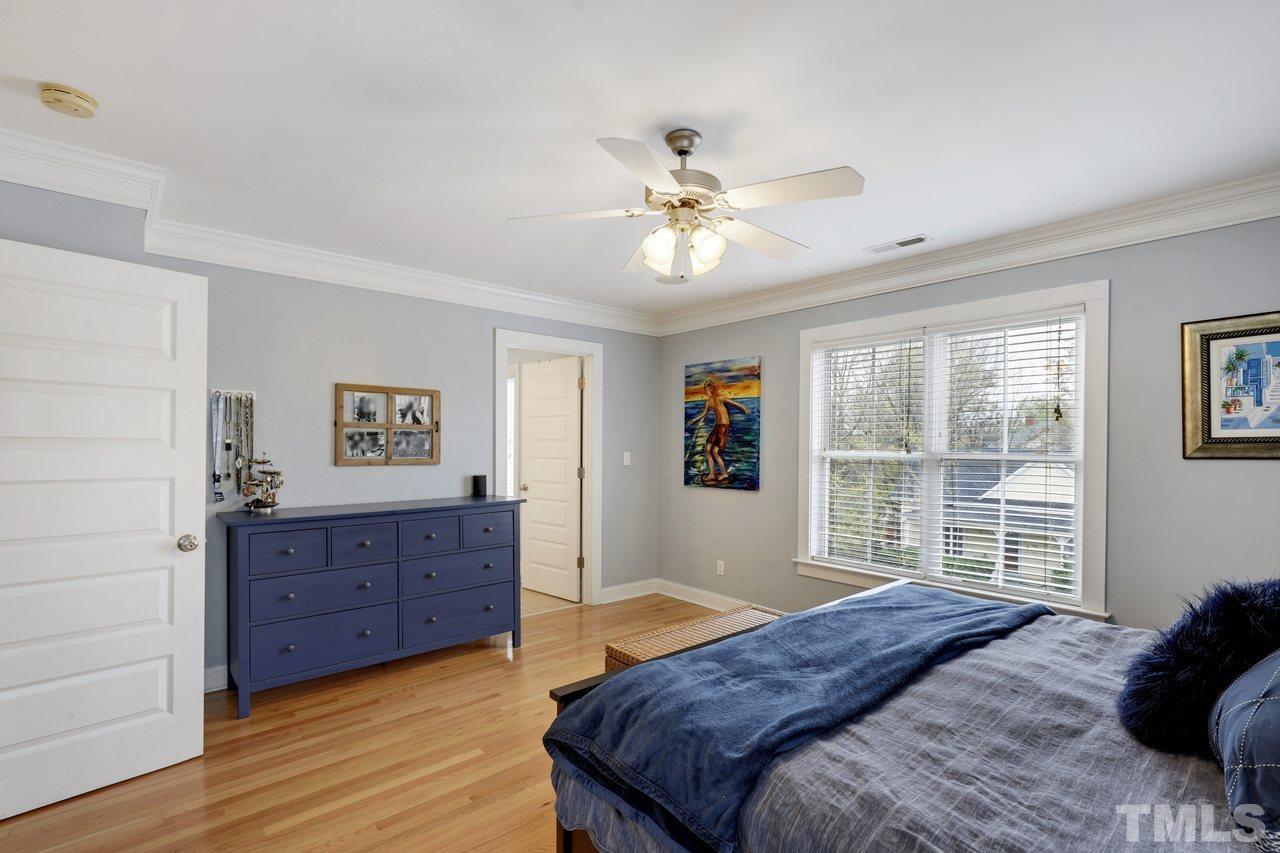 121 East Seeman Street Durham, NC 27701 - Photo 15 of 31 a bedroom with a bed dresser and a window