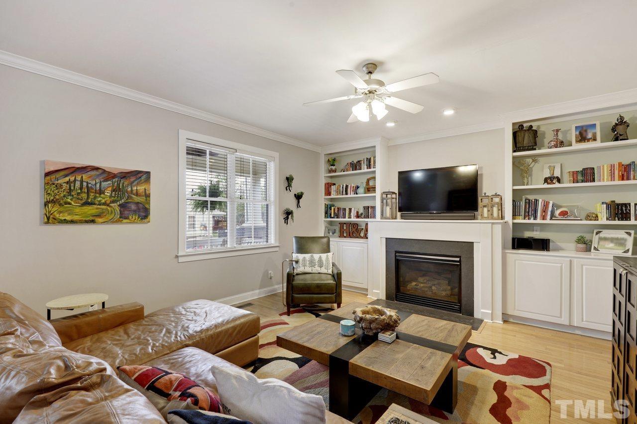 121 East Seeman Street Durham, NC 27701 - Photo 4 of 31 a living room with furniture fireplace and flat screen tv