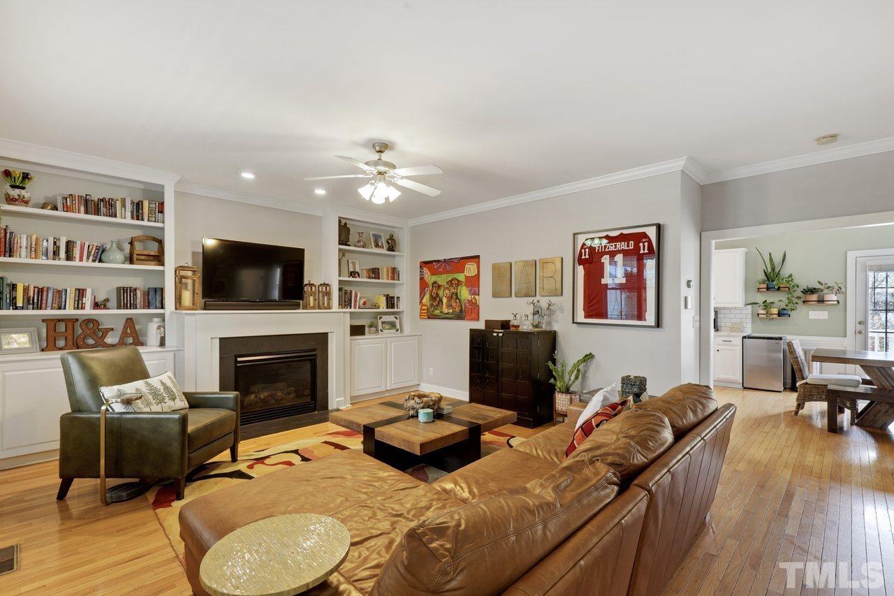 121 East Seeman Street Durham, NC 27701 - Photo 5 of 31 a living room with furniture flat screen tv and a fireplace