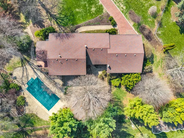 an aerial view of a house with a garden