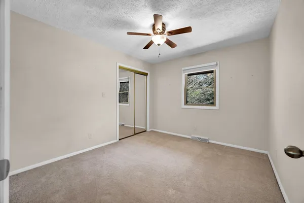 a living room with furniture and flat screen tv