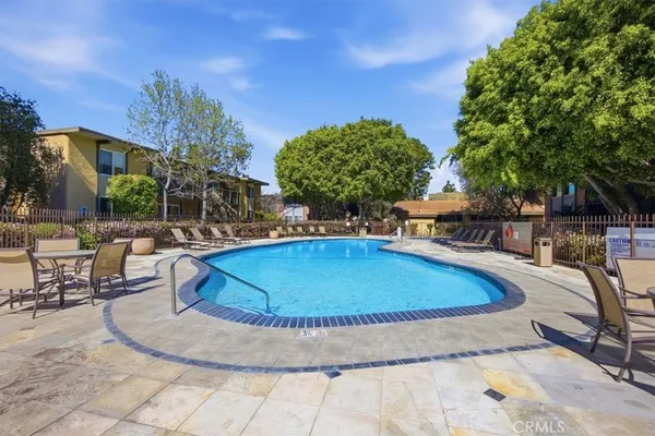 a view of a swimming pool with a lounge chairs