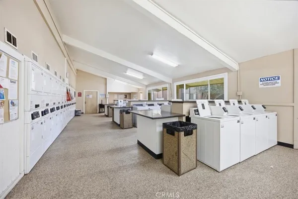 a kitchen with cabinets and white appliances