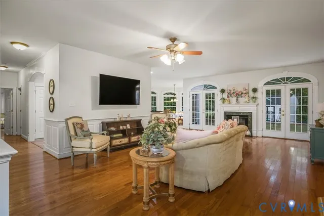 a living room with fireplace furniture and a flat screen tv