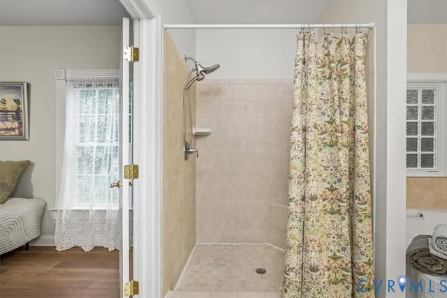 a bathroom with a shower curtain