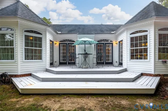 a view of a house with lounge chair and a large window