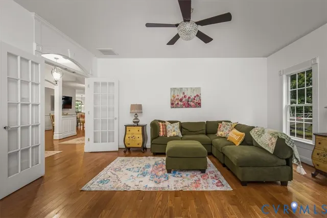 a living room with furniture and a rug