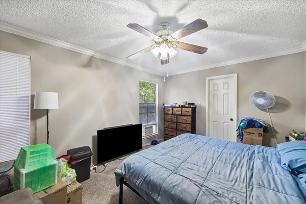 a bed room with a bed and a chandelier