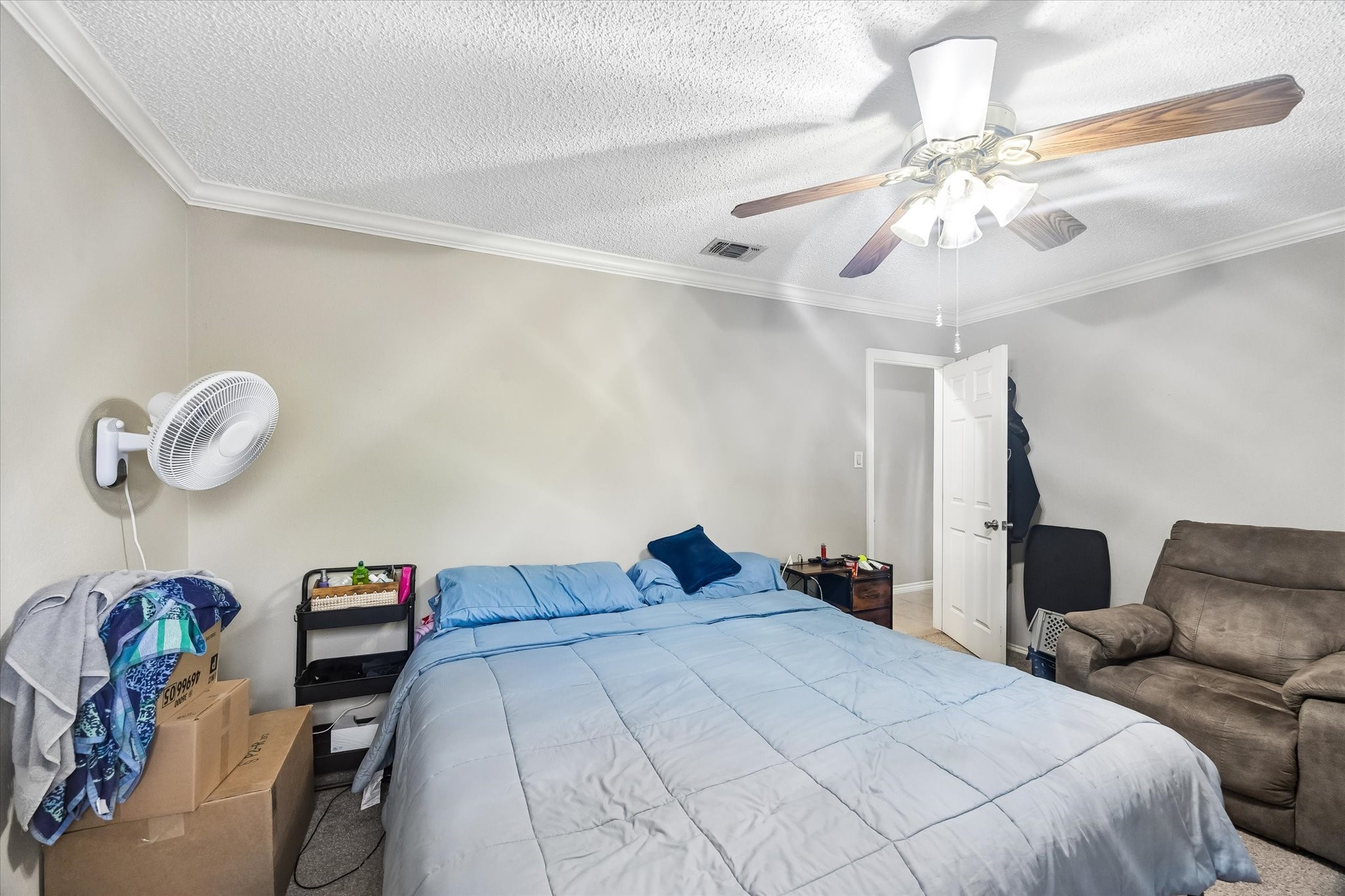 13533 George Road San Antonio, TX 78230 - Photo 18 of 34 a bedroom with a bed and chandelier