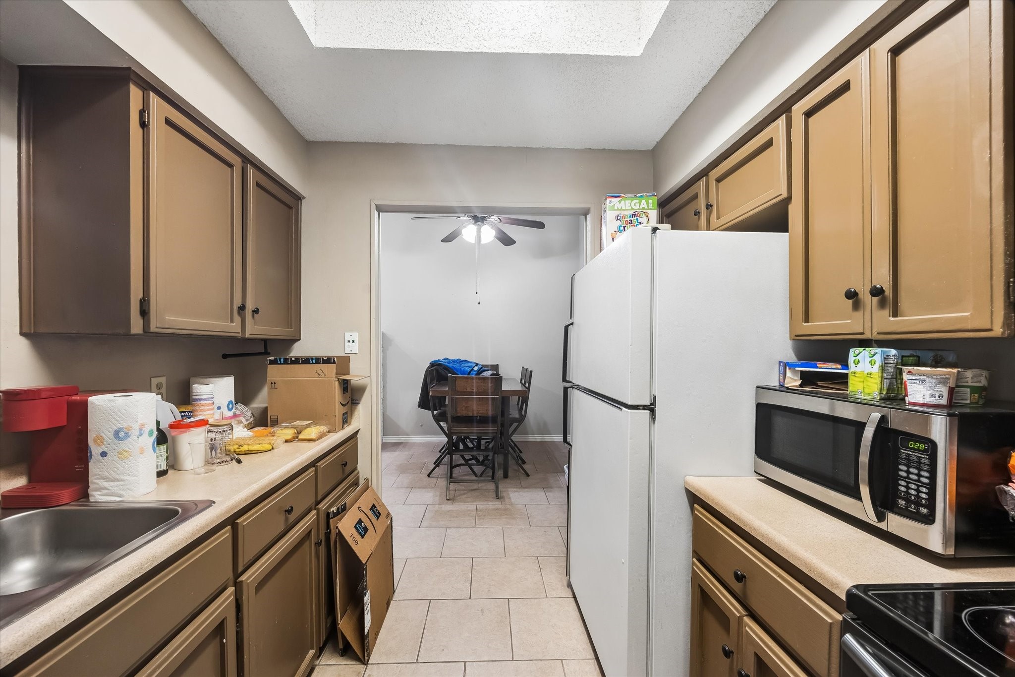 13533 George Road San Antonio, TX 78230 - Photo 27 of 34 a kitchen with a refrigerator and a sink