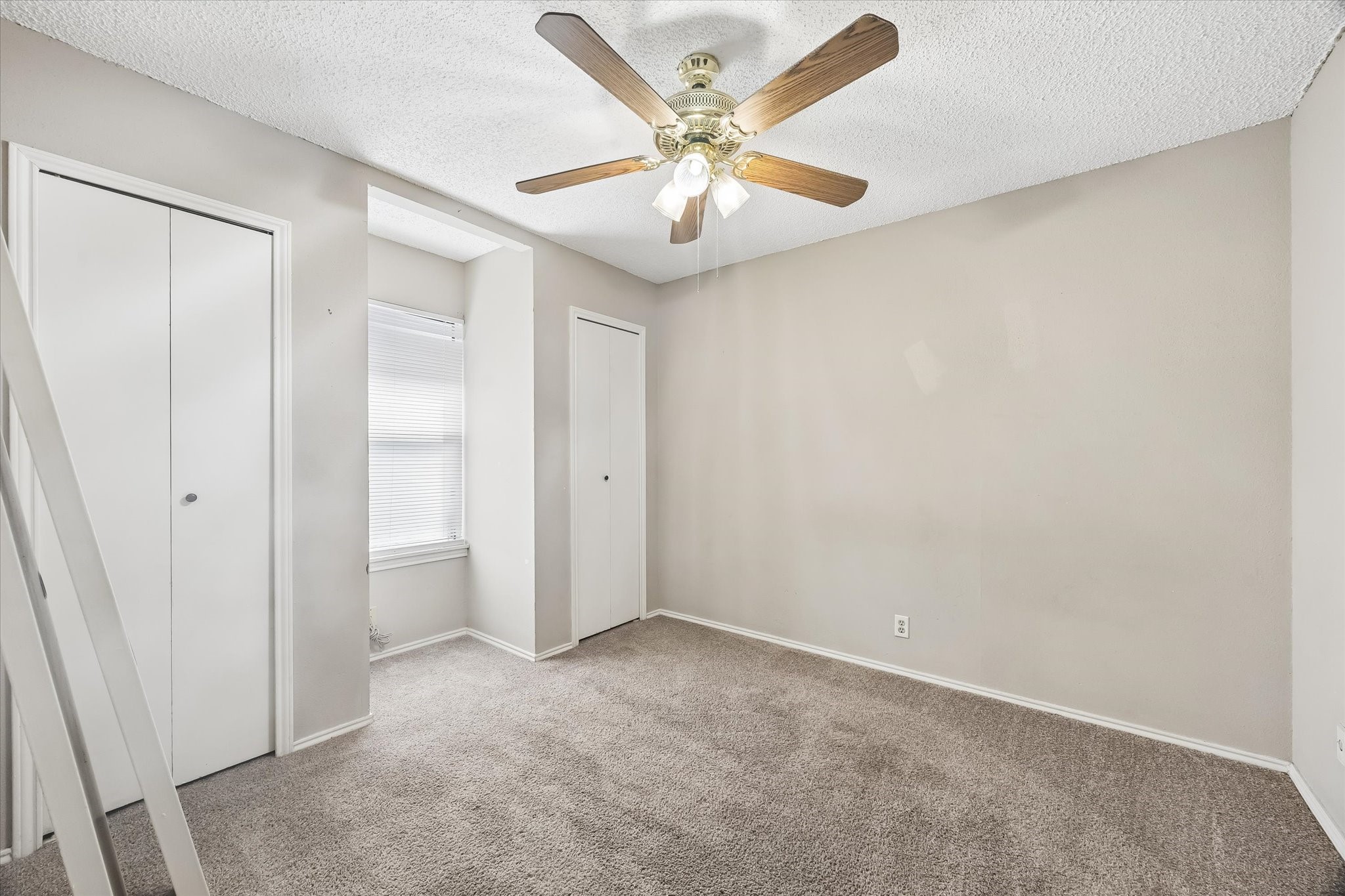 13533 George Road San Antonio, TX 78230 - Photo 28 of 34 an empty room with closet and fan