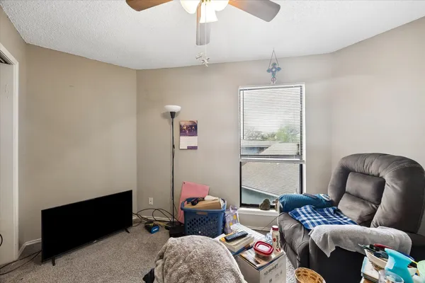 a bathroom with a sink vanity granite and toilet