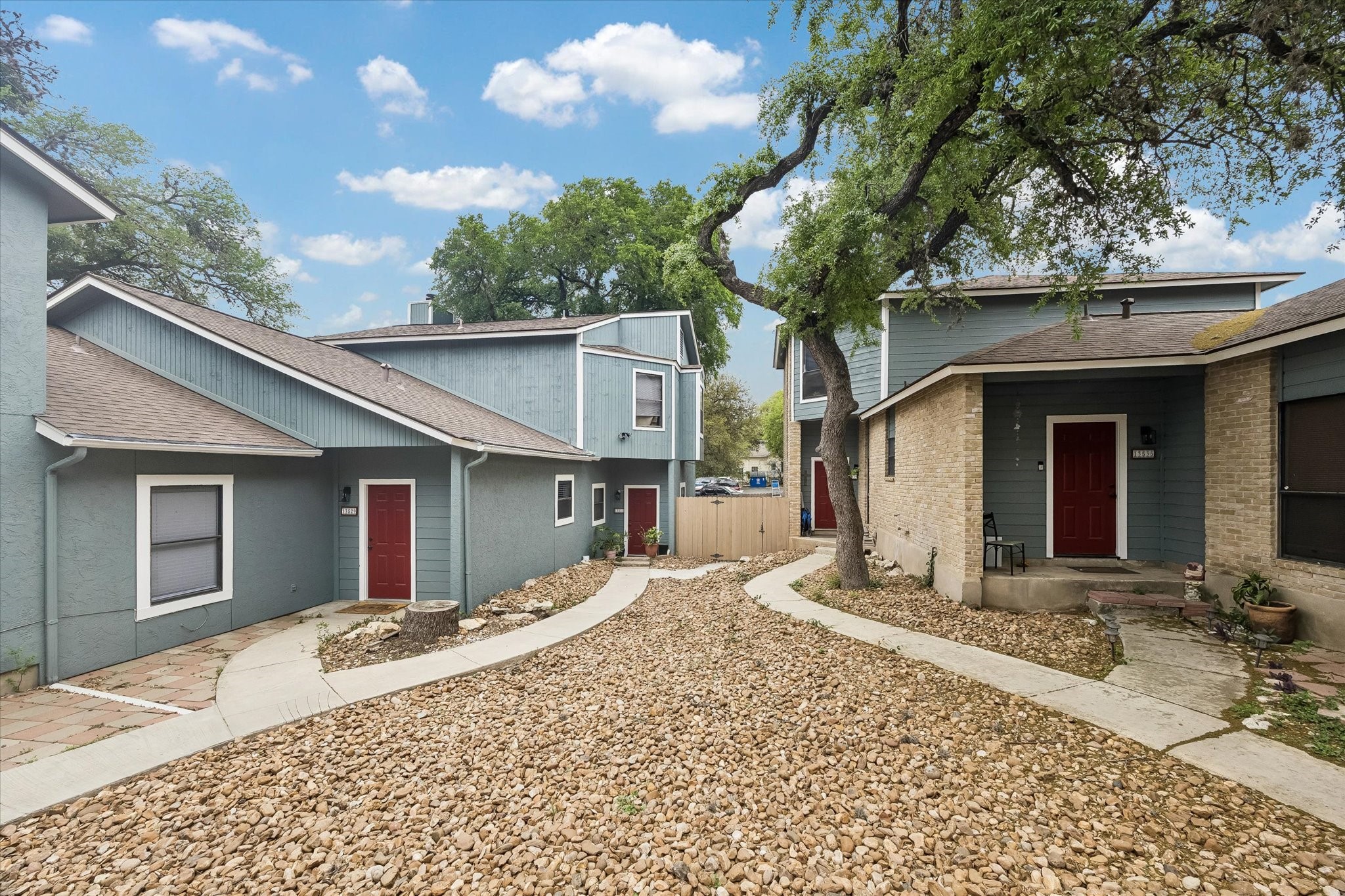 13533 George Road San Antonio, TX 78230 - Photo 4 of 34 a front view of a house with a yard and garage