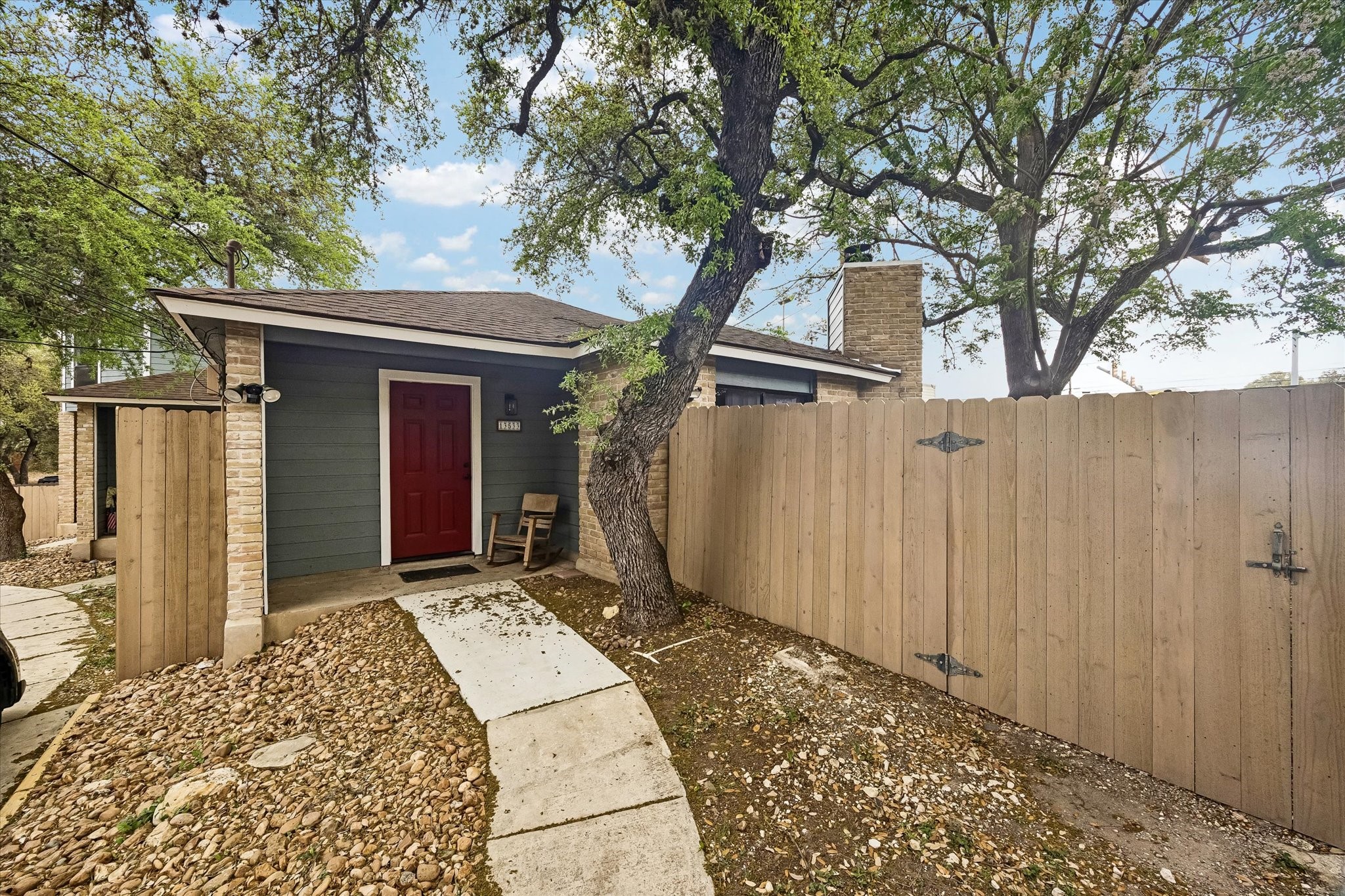 13533 George Road San Antonio, TX 78230 - Photo 5 of 34 a view of a house with a large tree