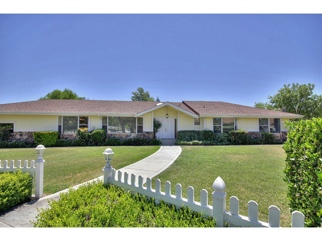 1300 Day Road Gilroy, CA 95020 - Photo 1 of 25 a front view of a house with a garden