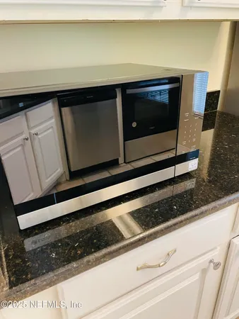 a view of staircase with white door