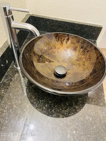 a view of a room with a ceiling fan and a window