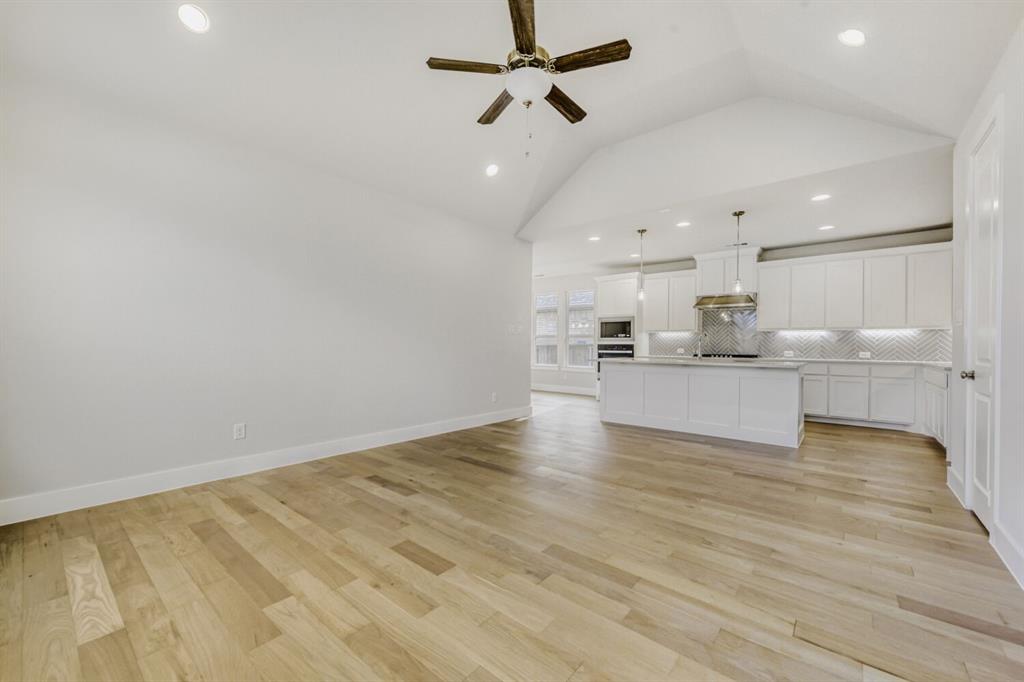 6033 Davis Knoll Road Fort Worth, TX 76126 - Photo 6 of 29 a view of kitchen with wooden floor