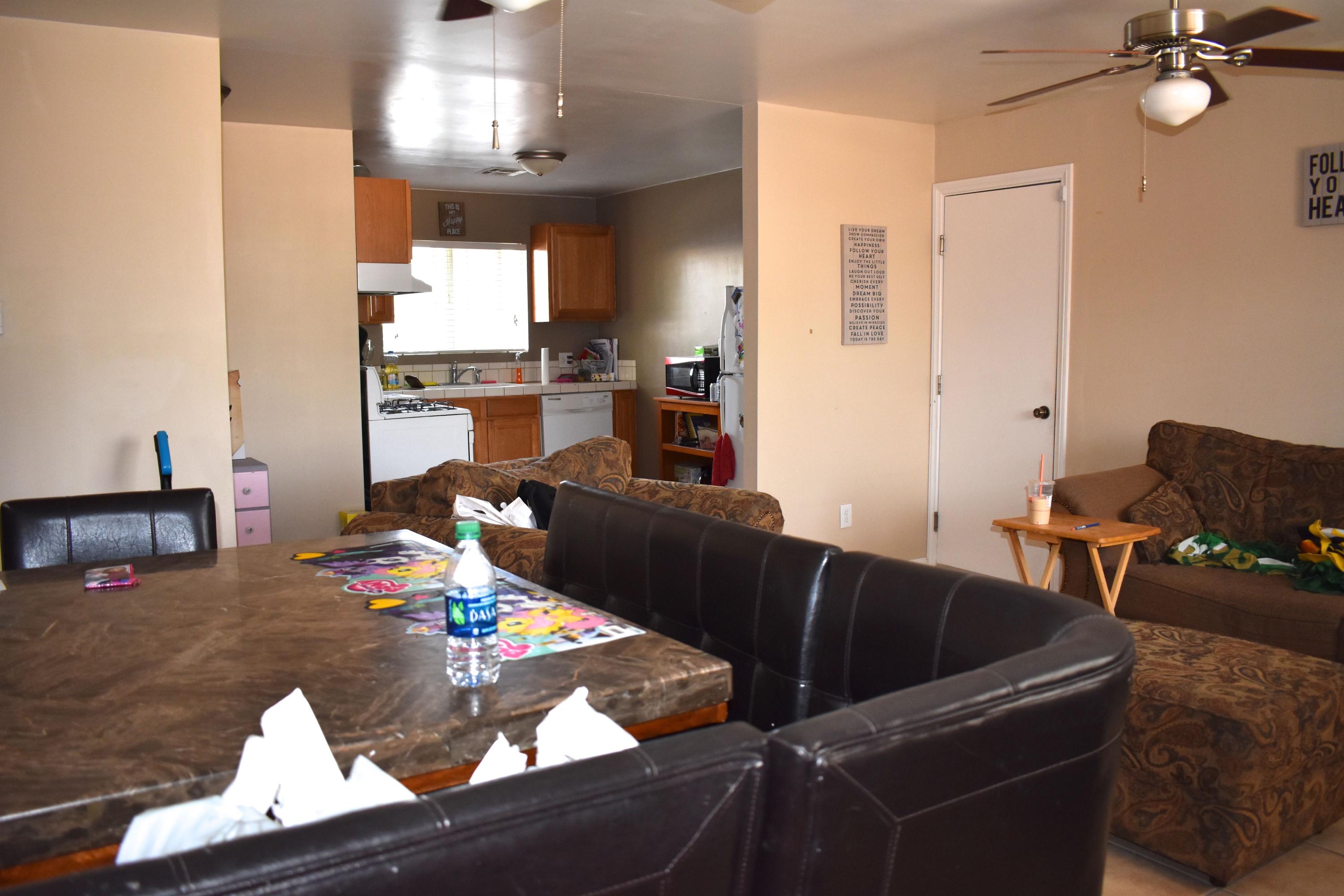44527 Date Avenue Lancaster, CA 93534 - Photo 15 of 20 a living room with furniture and a table