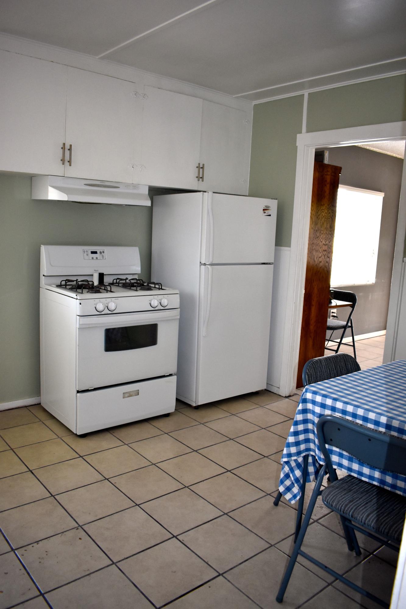 44527 Date Avenue Lancaster, CA 93534 - Photo 7 of 20 a white stove top oven sitting inside of a kitchen