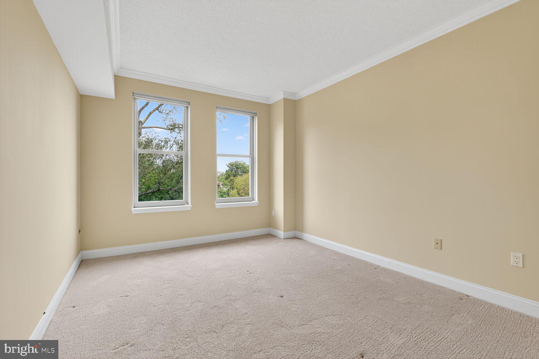 11776 Stratford House Place, Unit 507 Reston, VA 20190 - Photo 24 of 40 an empty room with windows