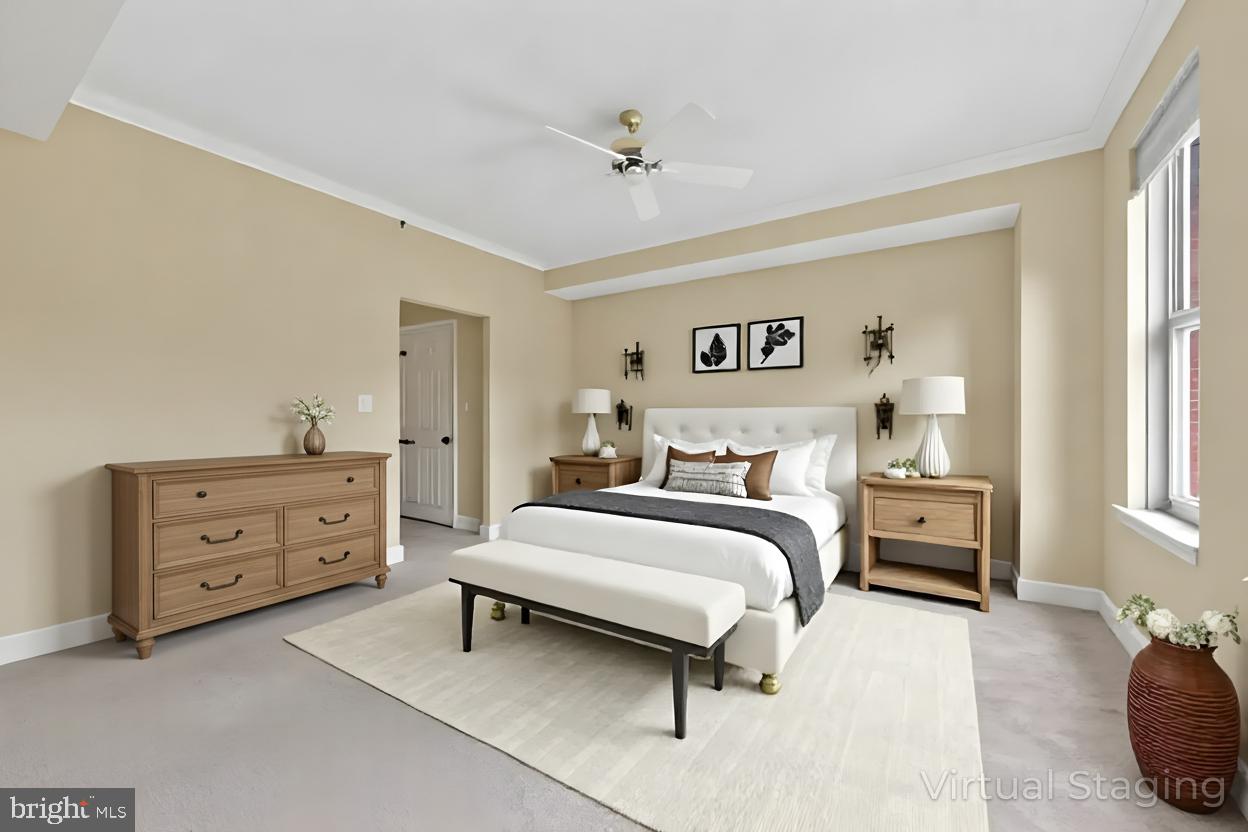 11776 Stratford House Place, Unit 507 Reston, VA 20190 - Photo 6 of 40 a bedroom with a bed and a dresser