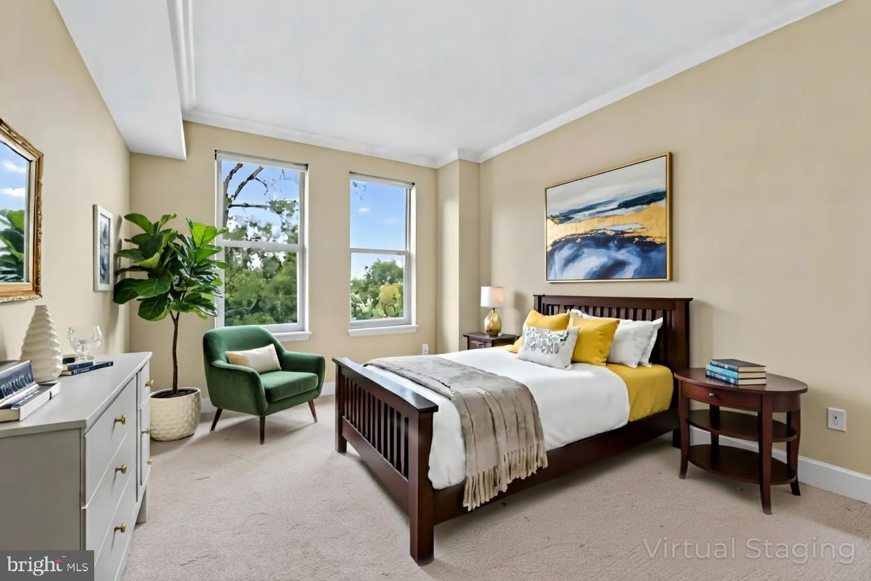 11776 Stratford House Place, Unit 507 Reston, VA 20190 - Photo 7 of 40 a bed room with a bed and a couch