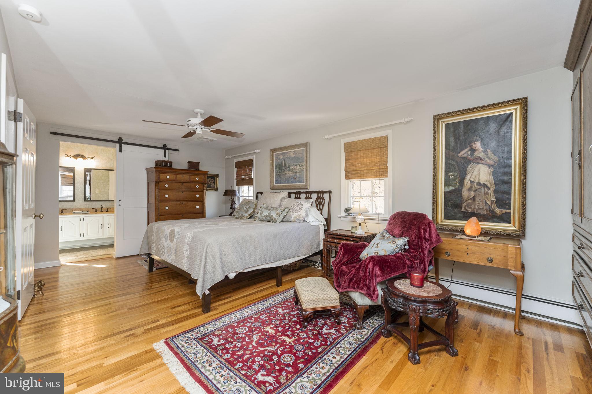 5101 Hiffletrayer Road Green Lane, PA 18054 - Photo 15 of 27 a bed room with a bed and glass door