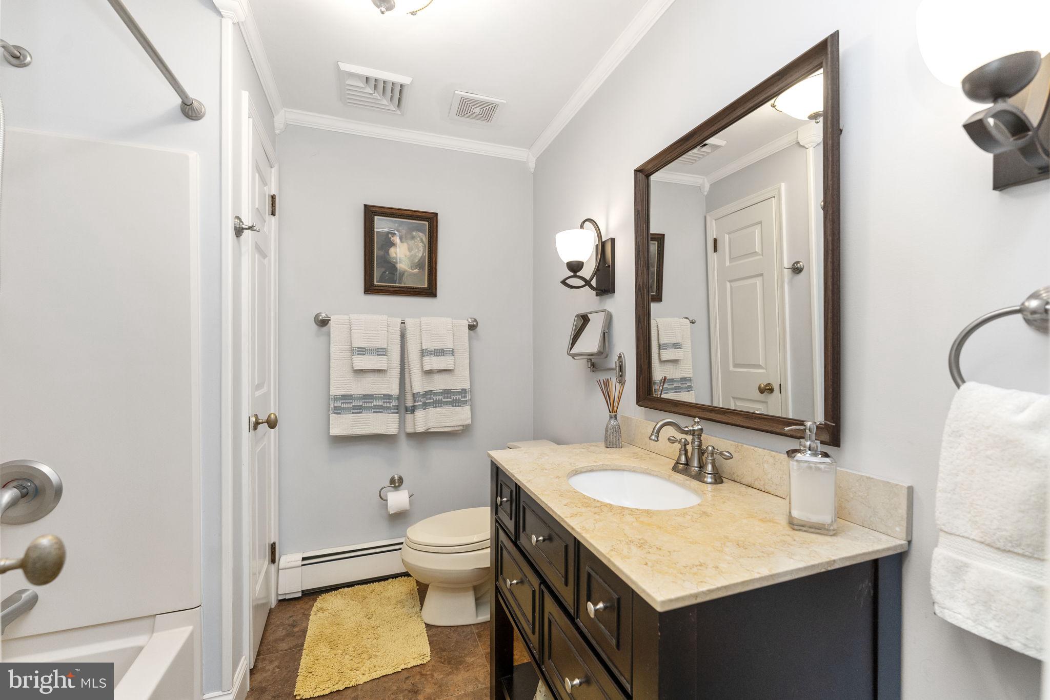 5101 Hiffletrayer Road Green Lane, PA 18054 - Photo 20 of 27 a bathroom with a granite countertop sink toilet and shower