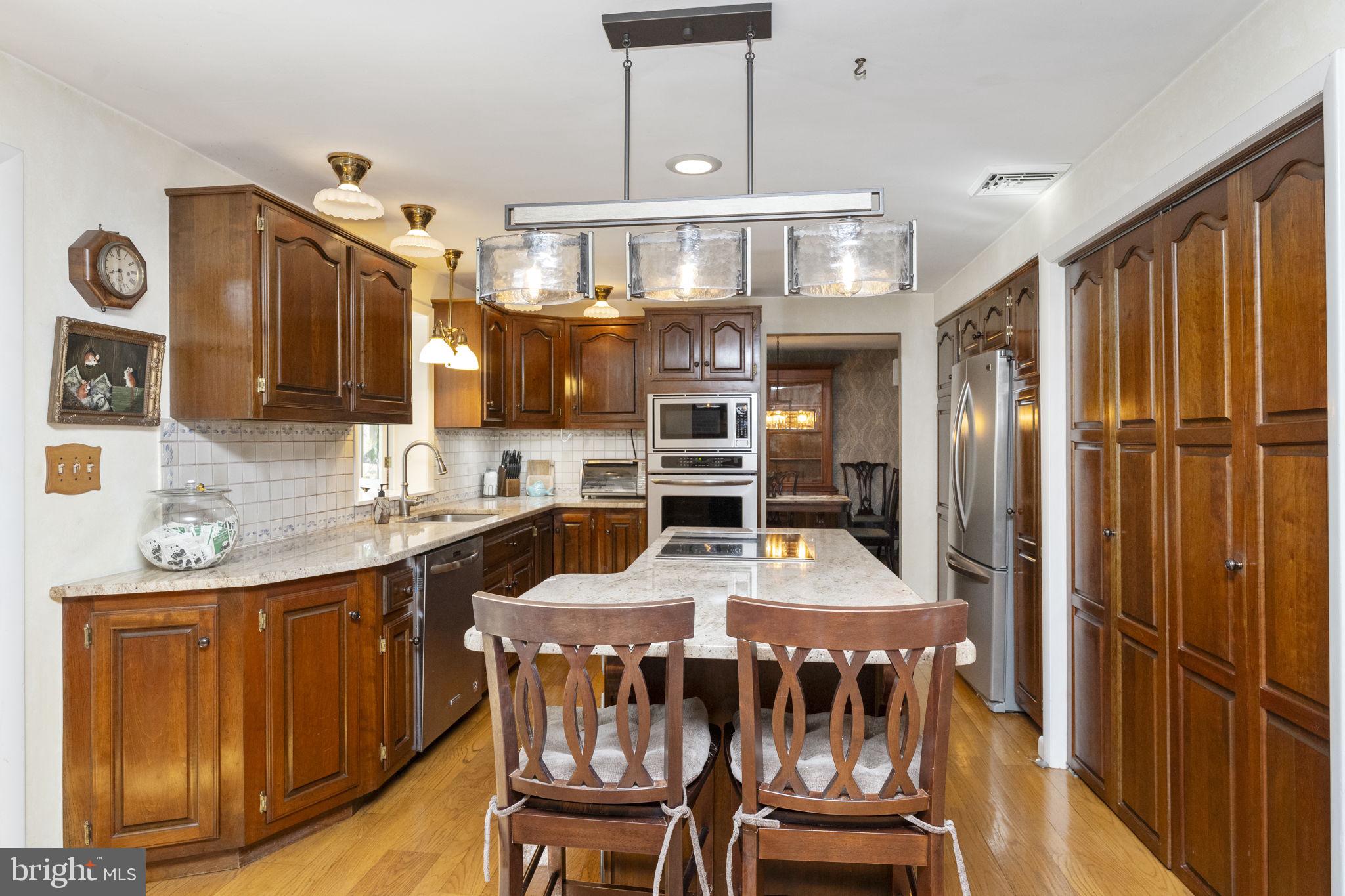 5101 Hiffletrayer Road Green Lane, PA 18054 - Photo 7 of 27 a kitchen with stainless steel appliances granite countertop a stove and a refrigerator