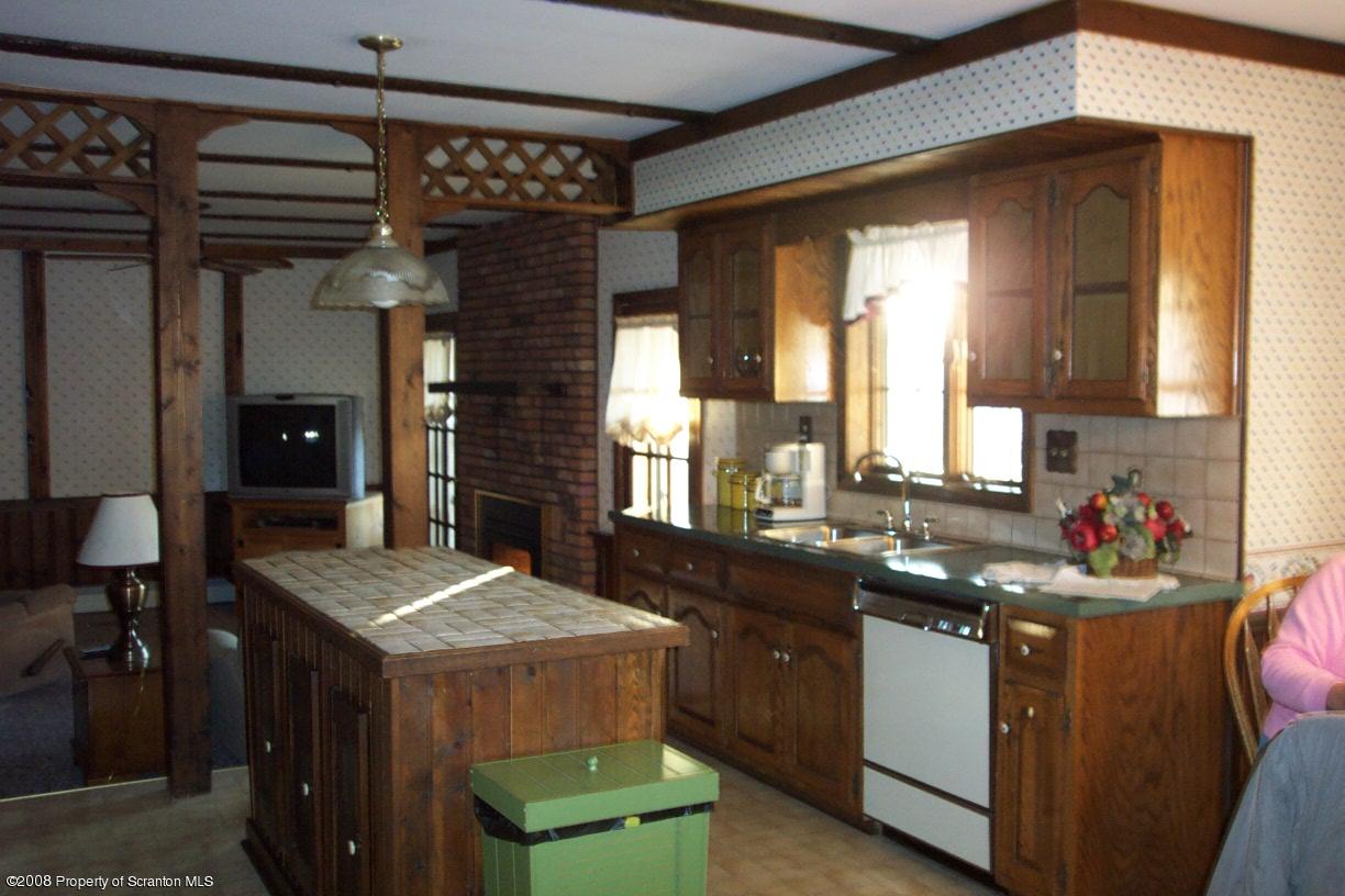3 Ledge Court Pittston, PA 18640 - Photo 3 of 12 a kitchen with a sink cabinets and window
