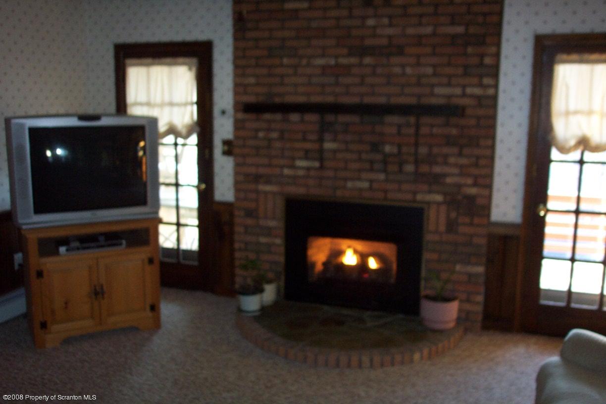 3 Ledge Court Pittston, PA 18640 - Photo 4 of 12 a living room with furniture and a fireplace