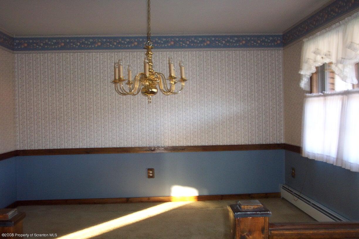 3 Ledge Court Pittston, PA 18640 - Photo 5 of 12 a view of a room with rack and chandelier