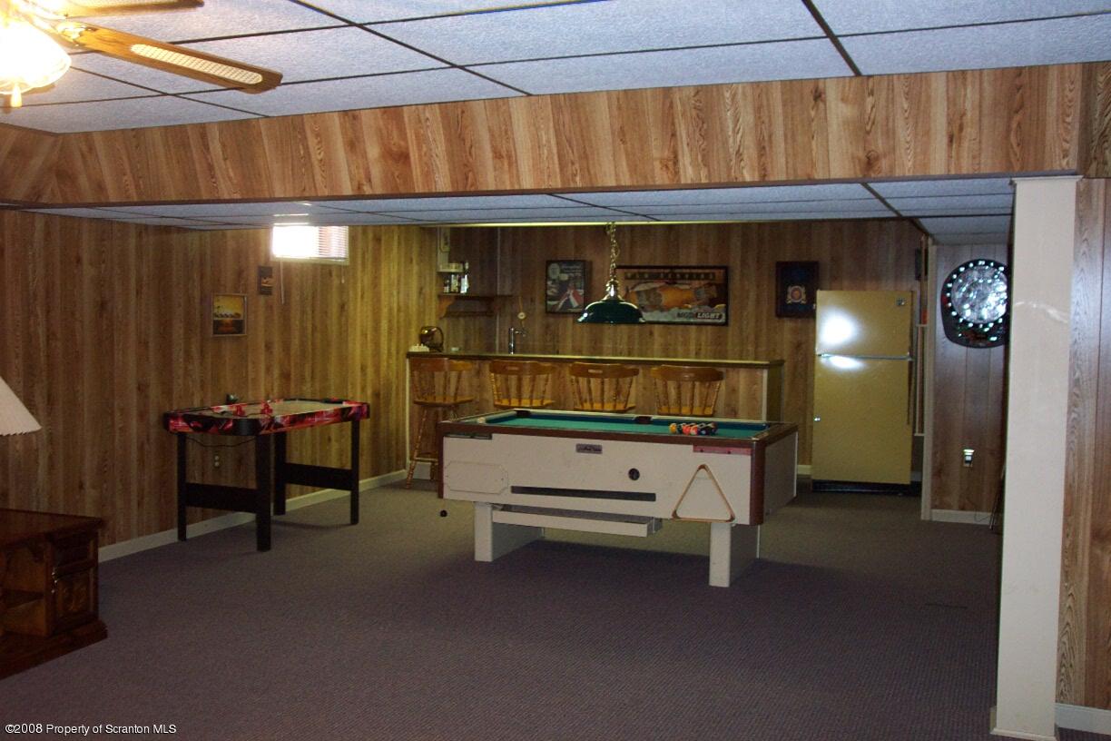 3 Ledge Court Pittston, PA 18640 - Photo 7 of 12 a room that has a bed and a table in it