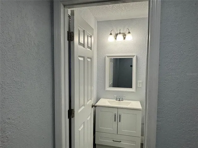 a bathroom with a shower toilet and sink