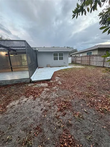 a backyard of a house with lots of green space