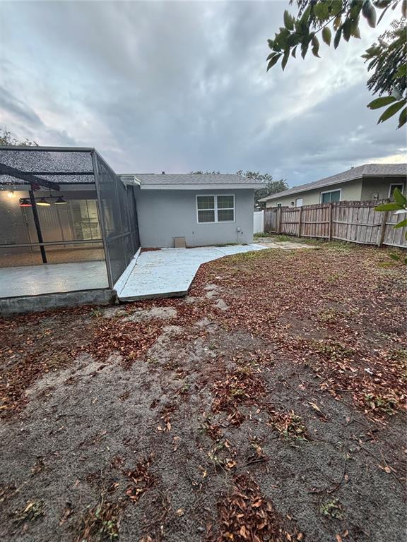 7185 Holiday Drive Spring Hill, FL 34606 - Photo 21 of 25 a front view of house with yard