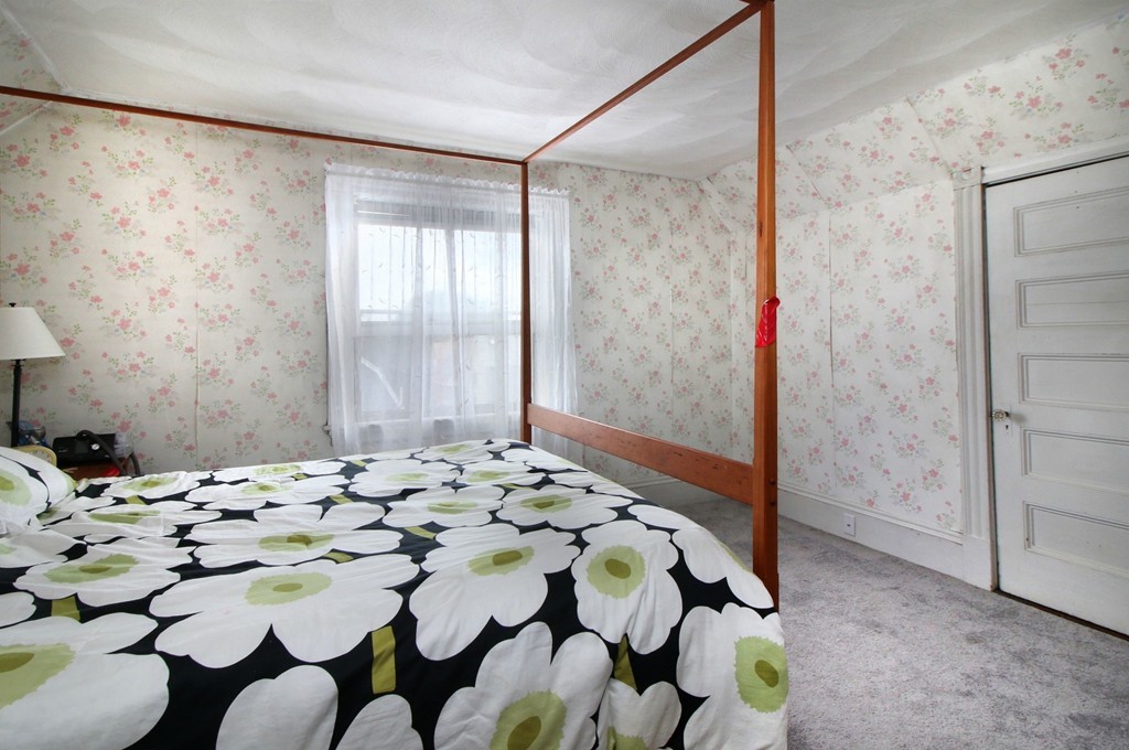 5 Pearson Road Somerville, MA 02144 - Photo 12 of 17 a bedroom with a bed and a window
