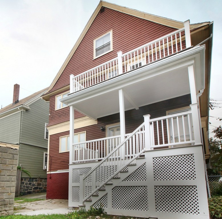 5 Pearson Road Somerville, MA 02144 - Photo 16 of 17 a view of a house with wooden fence