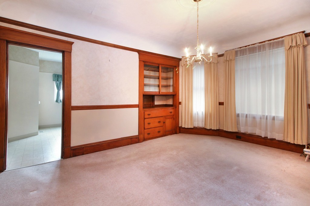 5 Pearson Road Somerville, MA 02144 - Photo 5 of 17 an empty room with chandelier fan and windows