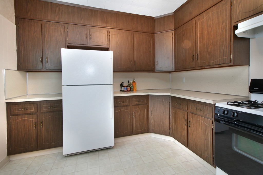 5 Pearson Road Somerville, MA 02144 - Photo 8 of 17 a kitchen with cabinets a refrigerator and a stove