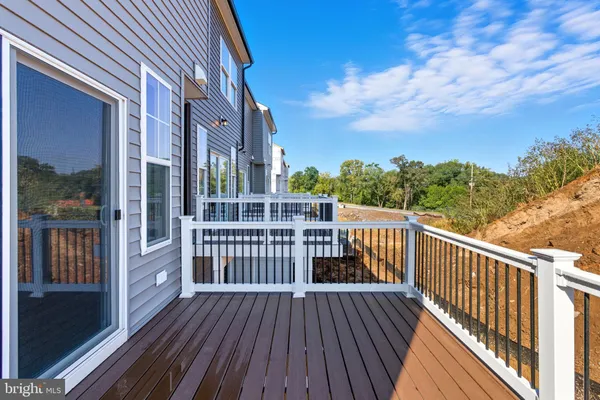 a view of a balcony with wooden floor